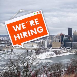 city of pittsburgh with "we're hiring" sign overlay