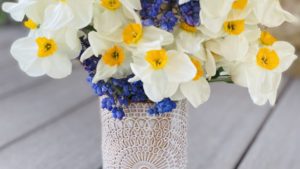 Spring flowers inside a handmade ceramic vase.