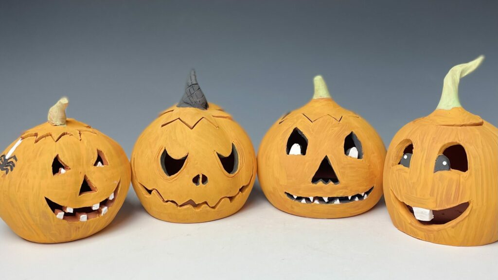 Painted and carved ceramics pumpkins.